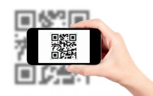 Hand Holding Mobile Phone With Qr Code Scanner